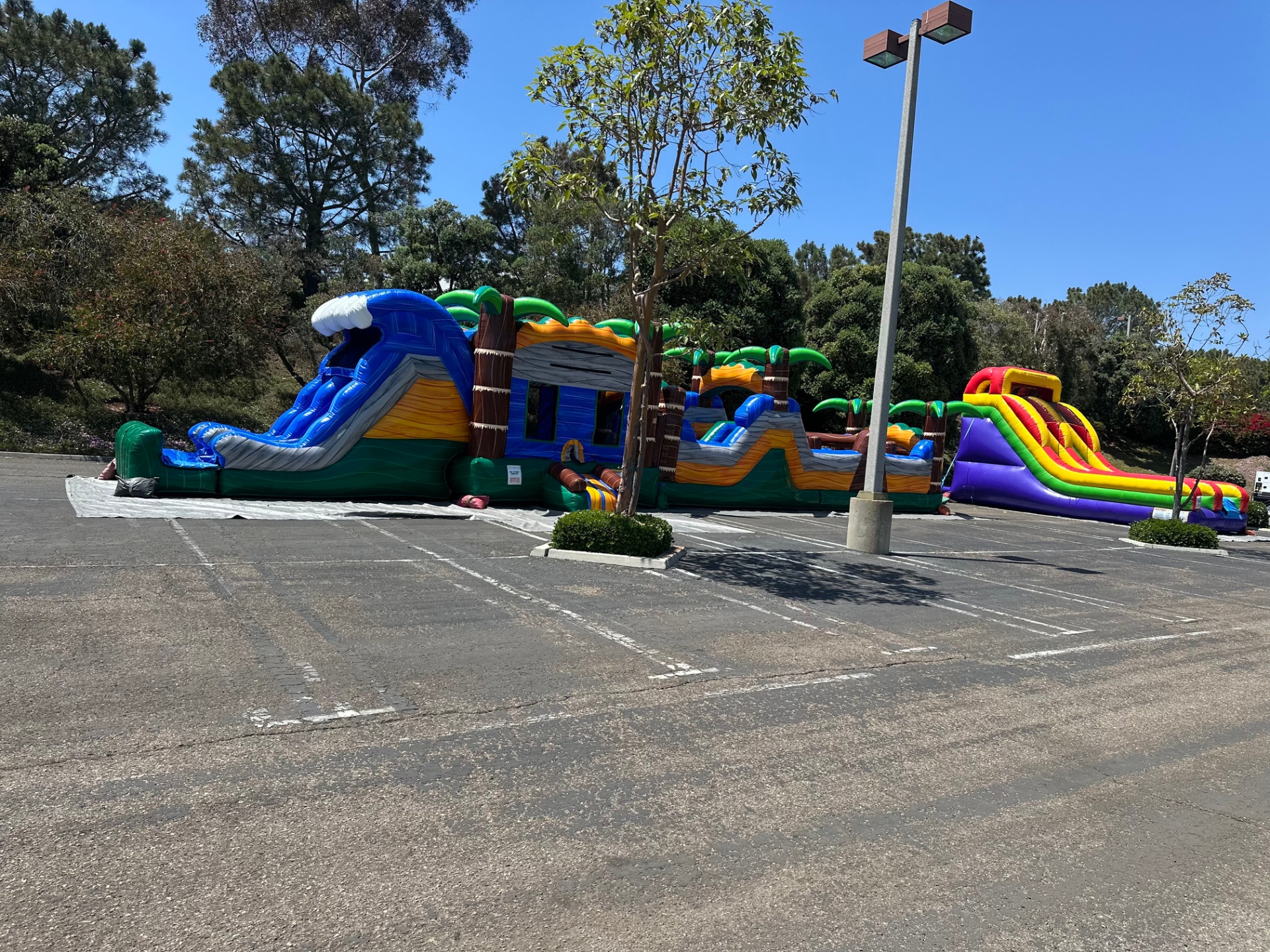 63ft tropical obstacle course rental in San Diego, wide view showing the complete 63-foot footprint