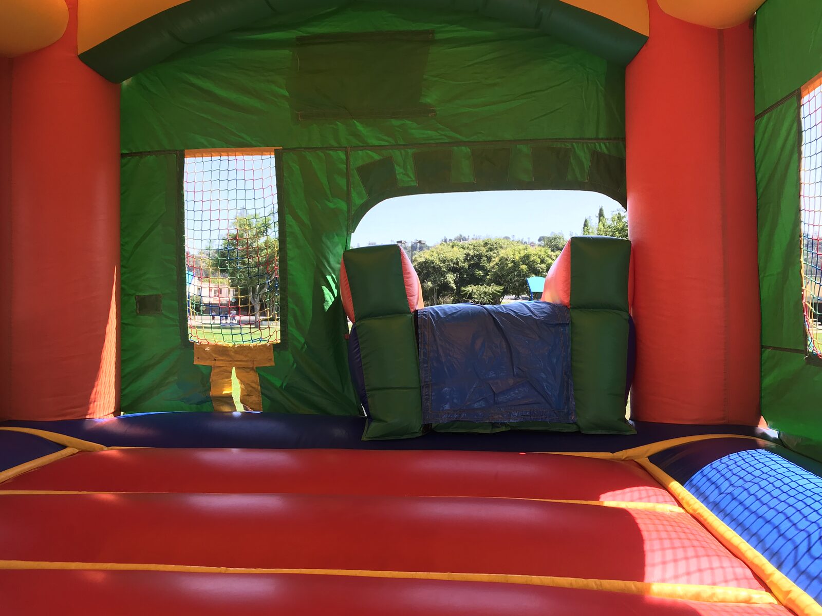 2n1 summer balloon combo bounce house rental in San Diego, wide interior view of the jump area and slide entrance