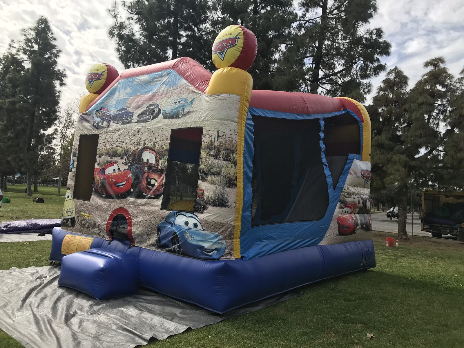 4n1 cars combo bounce house rental in San Diego, interior view of the jump floor, basketball hoop, and climb-up