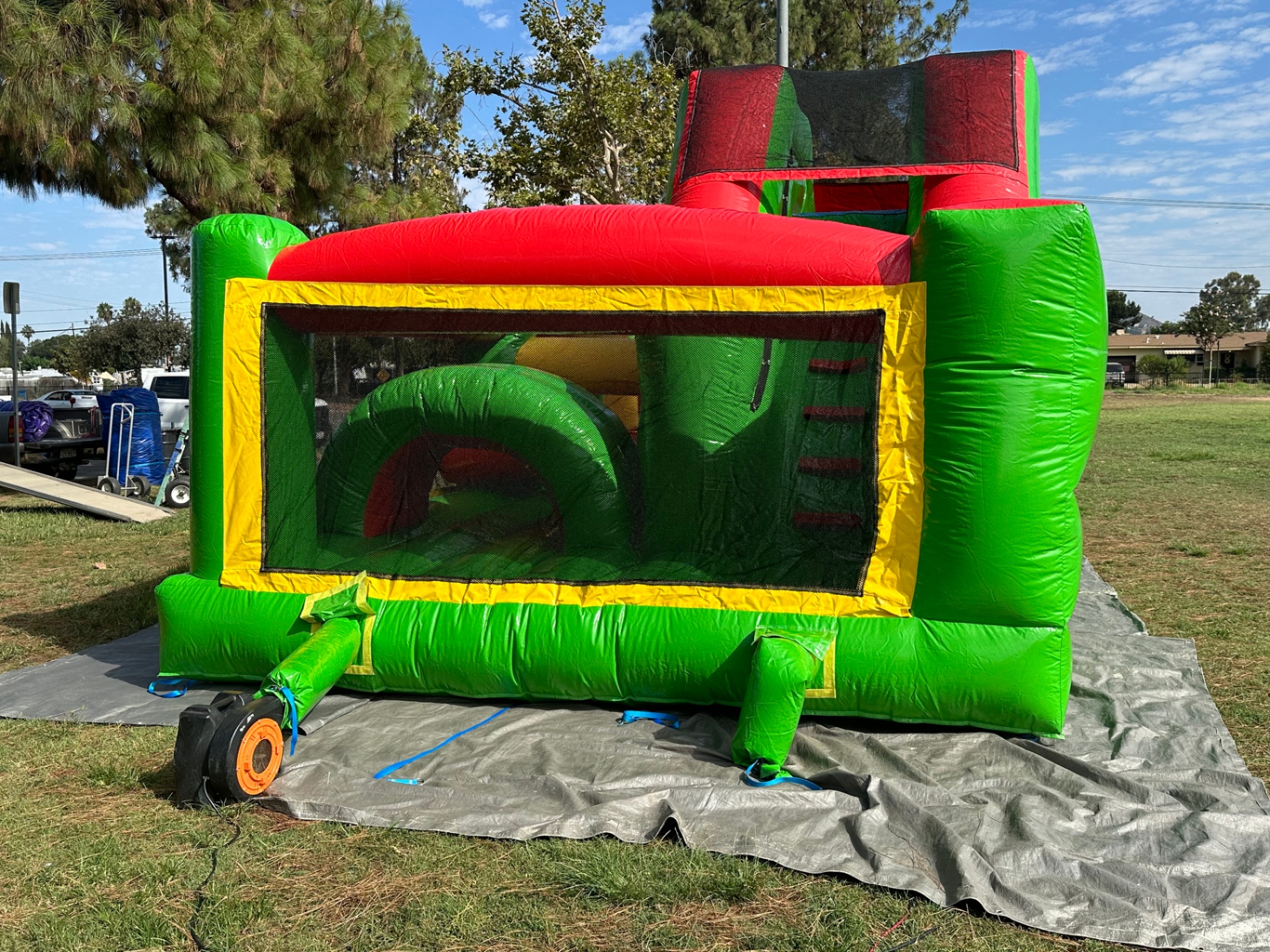 Challenge course obstacle rental in San Diego, green and red lane, rear view through the mesh window with the blower attached