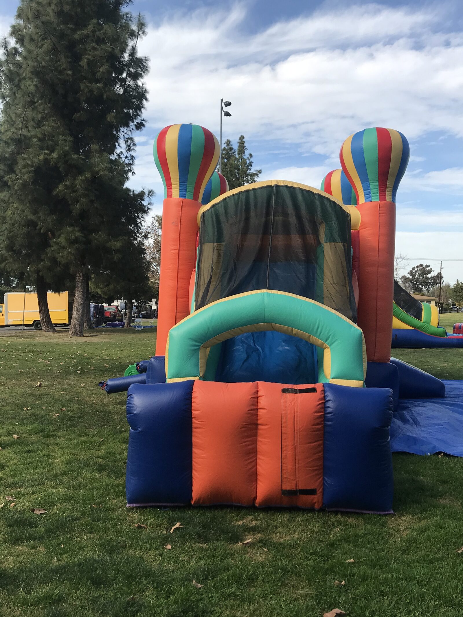 4n1 summer balloon combo bounce house rental in San Diego, rear view of the slide exit and shaded top canopy