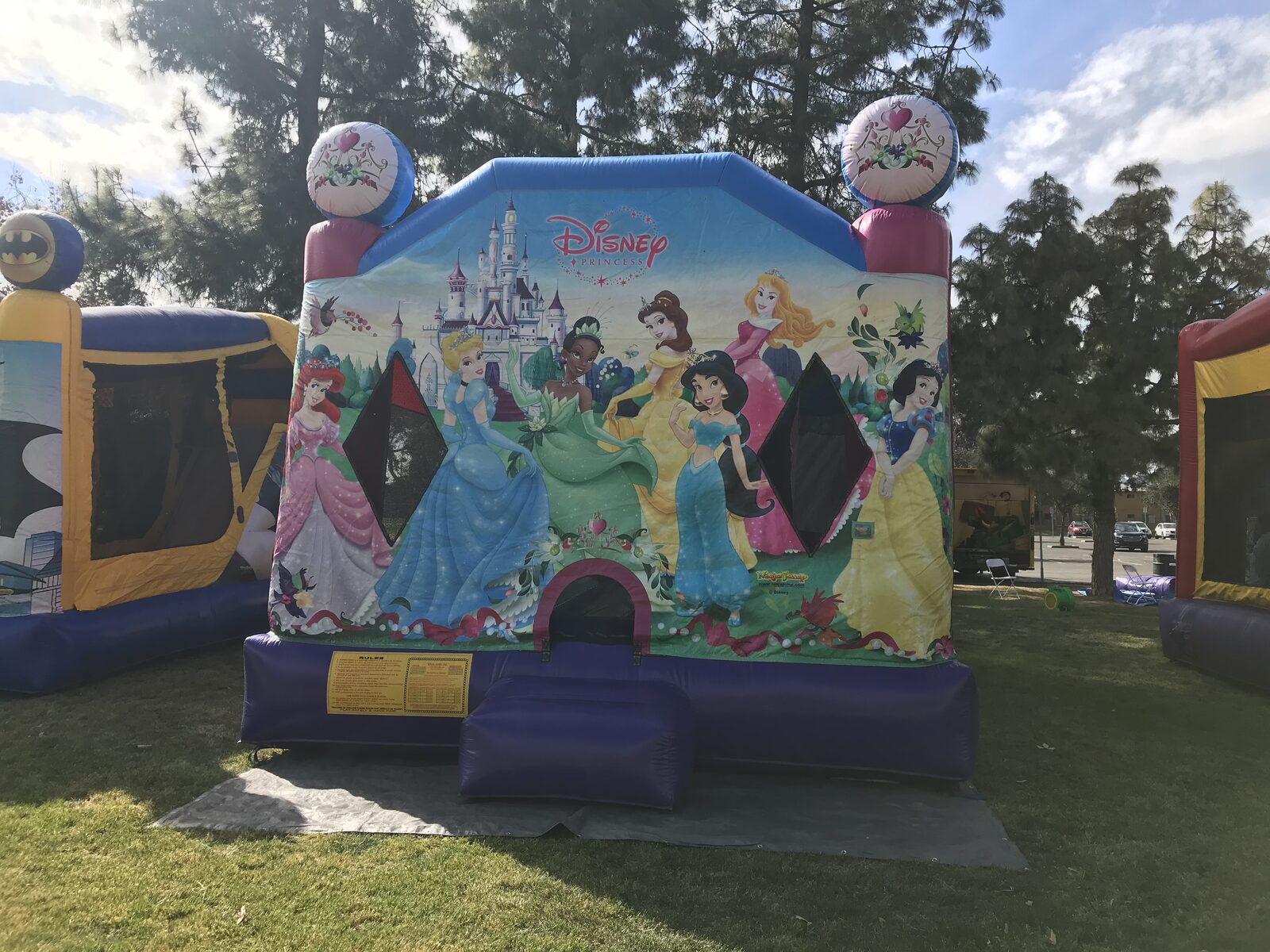 4n1 princess combo bounce house rental in San Diego, front view of the Disney Princess castle art panel with heart-crown towers and arched entry step