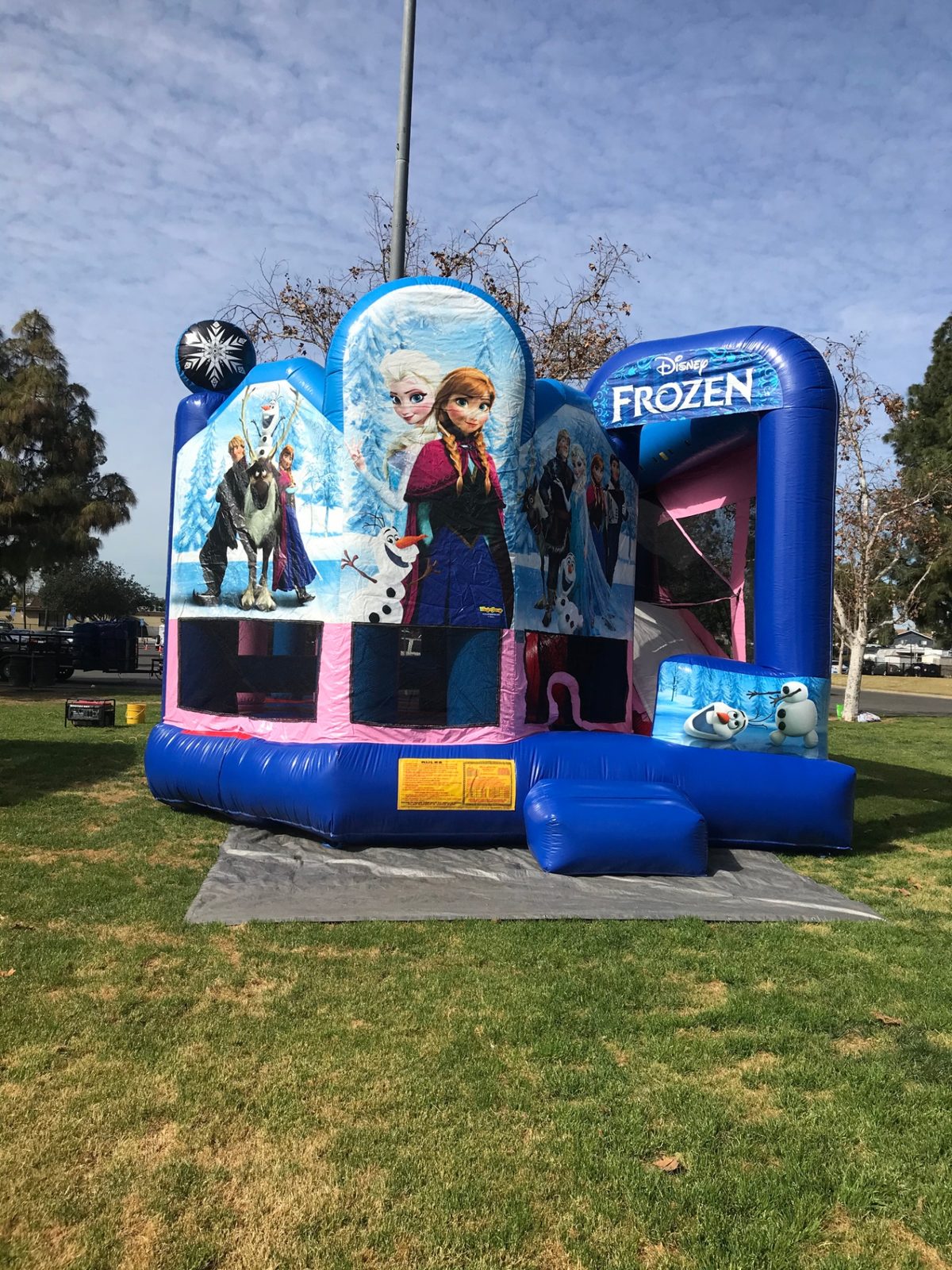 5n1 frozen combo bounce house rental in San Diego, angled front view of the snowflake turret and Olaf entry panel