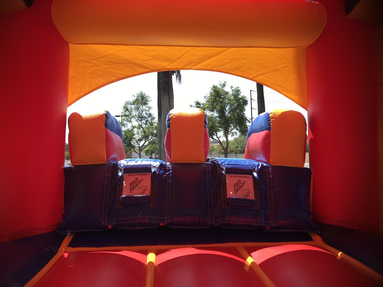 3n1 blue castle banner combo bounce house rental in San Diego, interior view of the climb-up grab handles leading to the slide