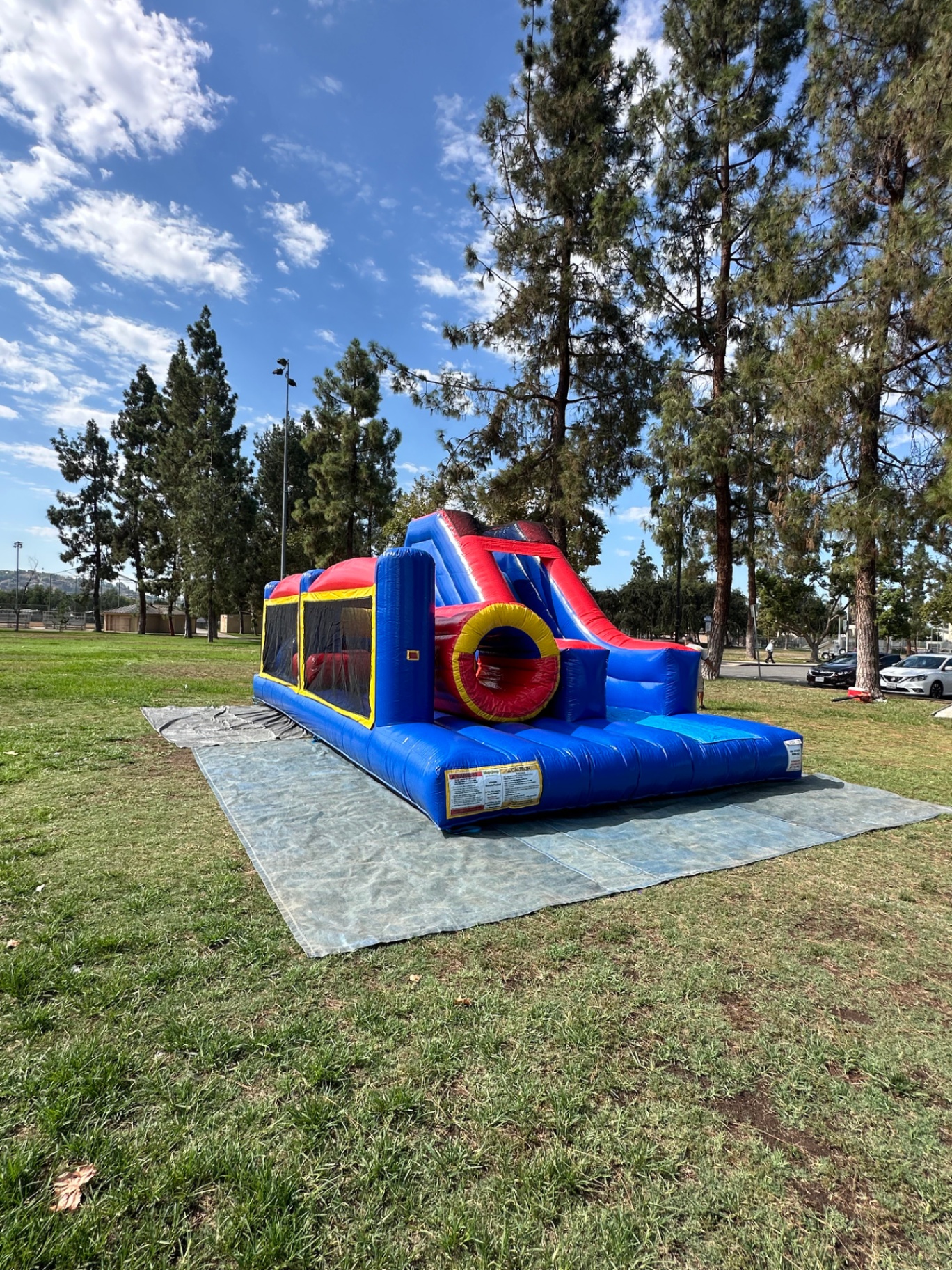 Challenge course obstacle rental in San Diego, blue and red lane, side profile showing the full course length with mesh windows