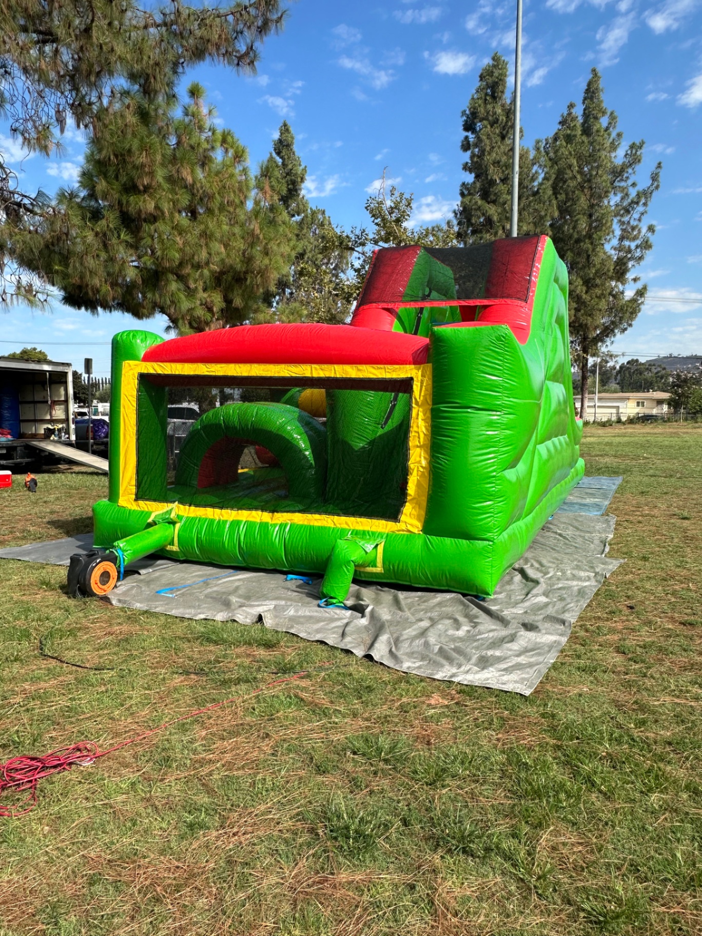 Challenge course obstacle rental in San Diego, green and red lane, angled rear view of the entry section and climb wall