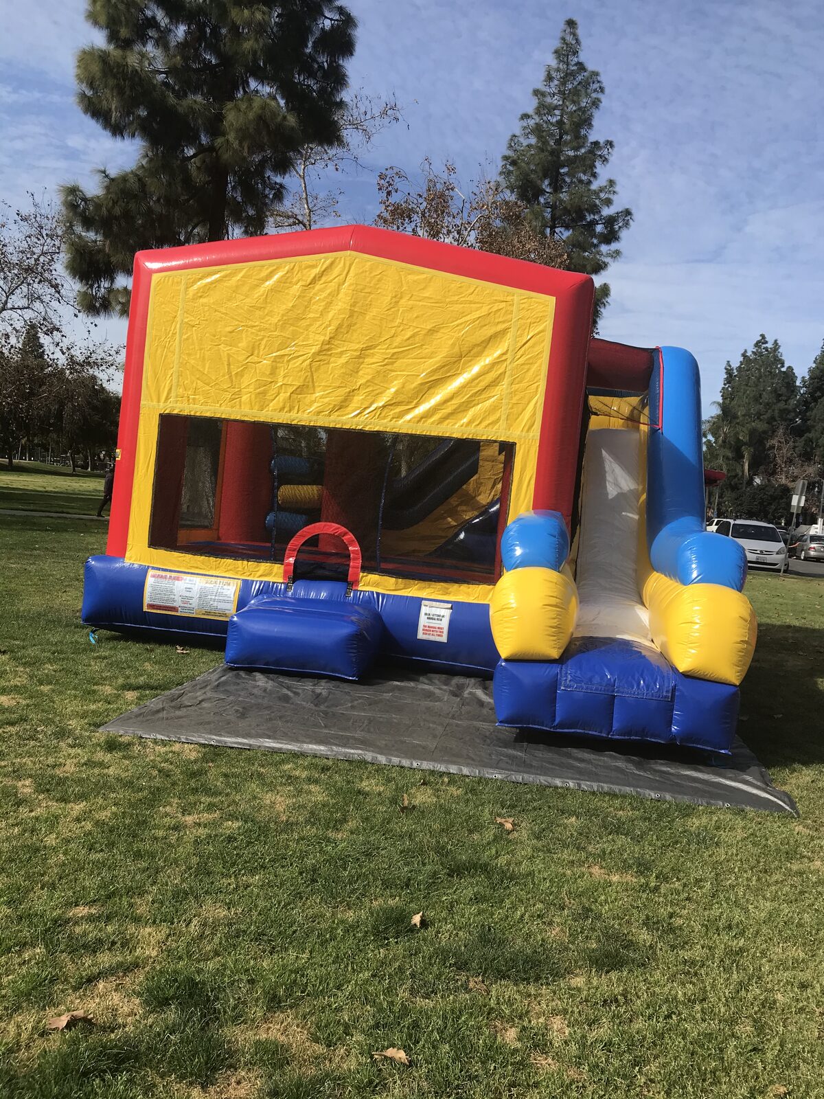 6n1 banner combo bounce house rental in San Diego, interior view of the jump floor, basketball hoops, and pop-up obstacles