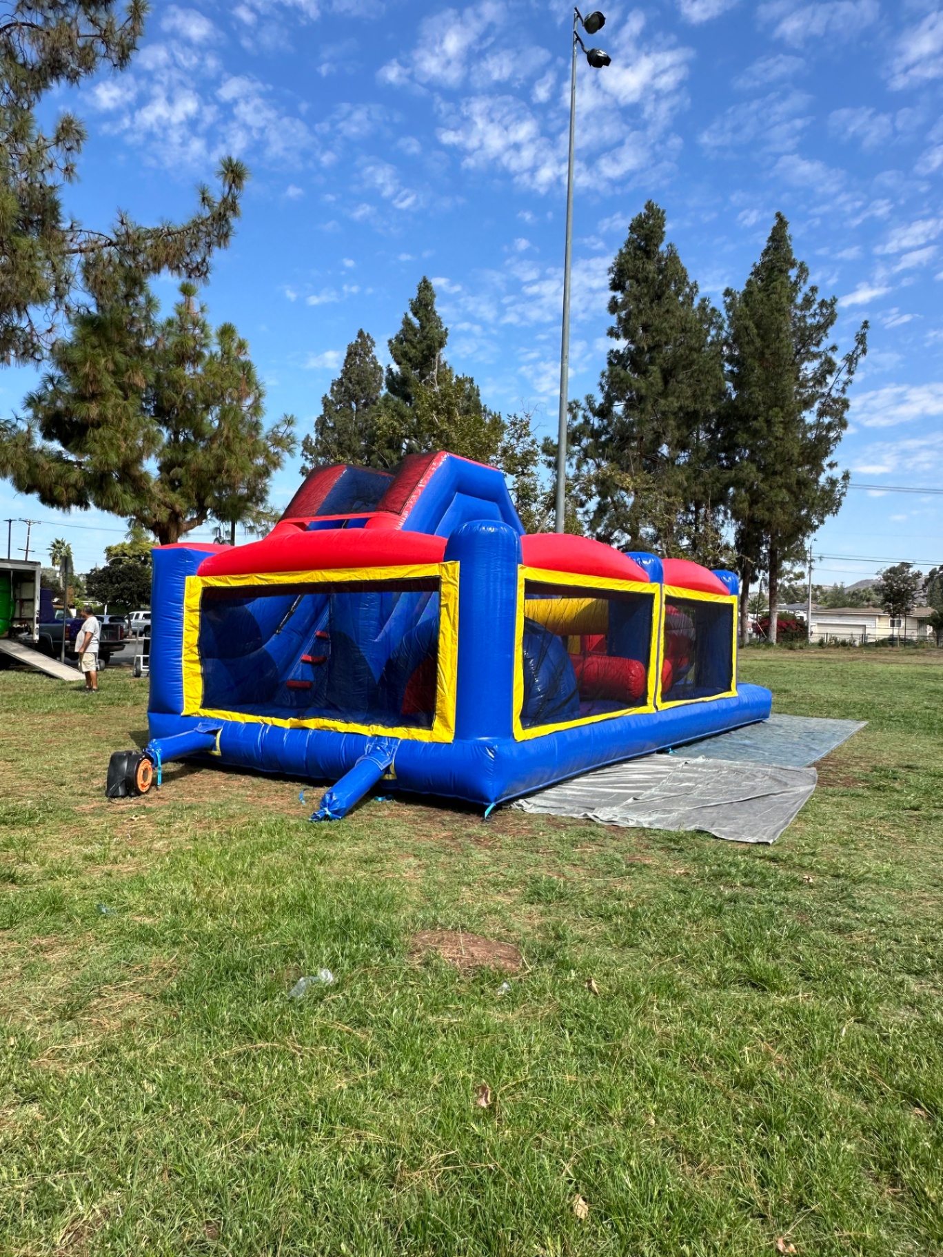 Challenge course obstacle rental in San Diego, blue and red lane, three-quarter view of the climb section and interior obstacles