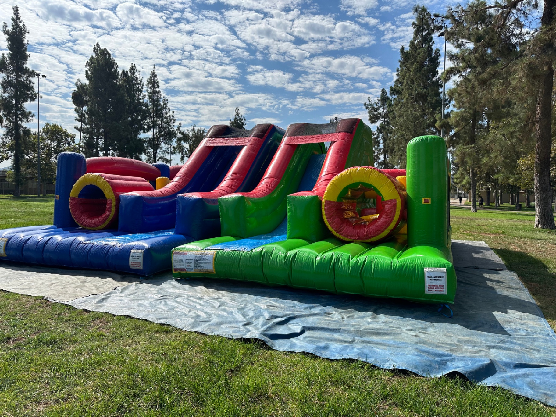 Dual lane challenge course obstacle rental in San Diego, front view of both slide lanes and the red-and-yellow crawl tunnels