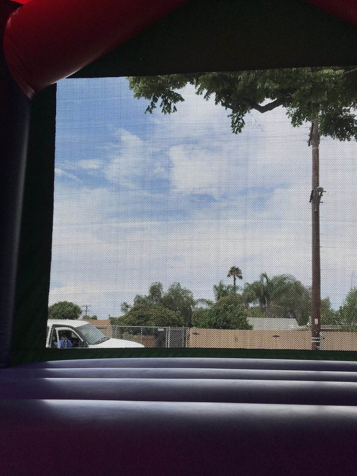 13x13 Incredible Hulk bounce house rental in San Diego — inside view of the purple jumping floor and mesh safety window