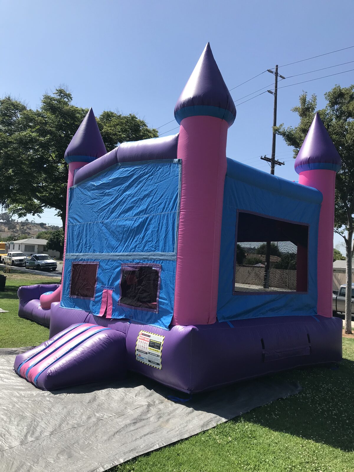 3n1 pink castle banner combo bounce house rental in San Diego, interior view of the jump floor, basketball hoop, and climb-up to the slides