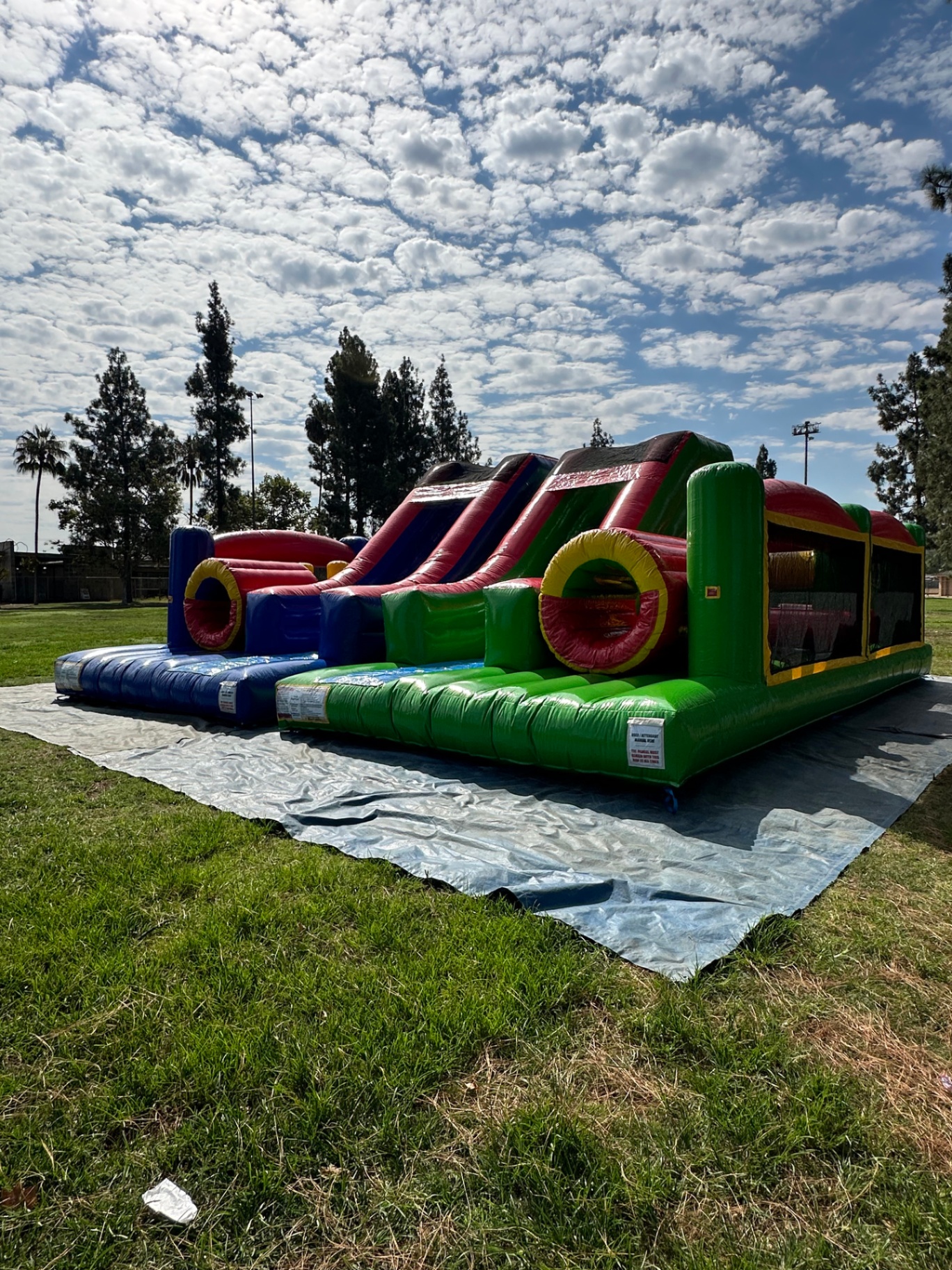Dual lane challenge course obstacle rental in San Diego, side profile of both lanes with the slide landings in the foreground