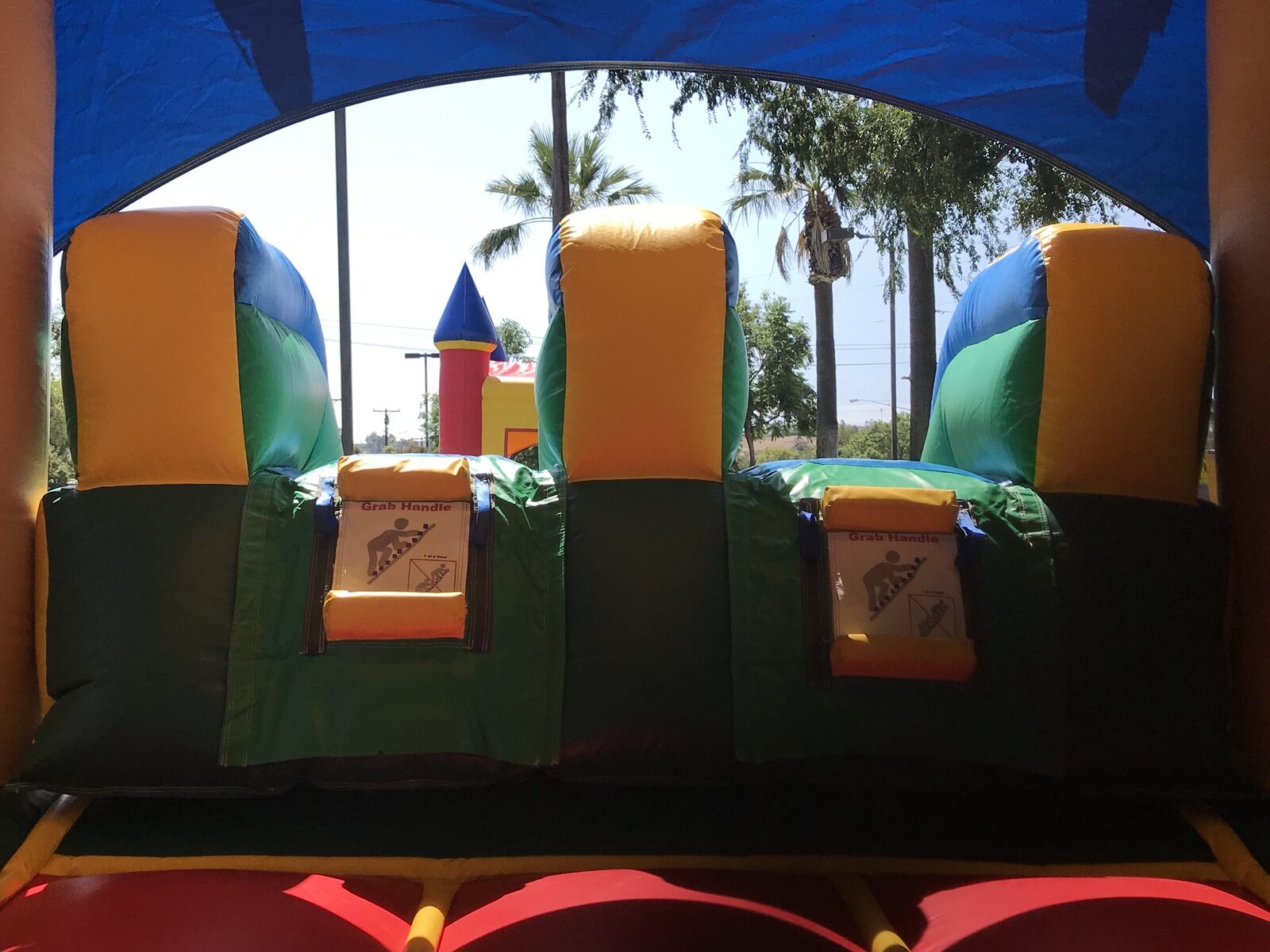 3n1 palm tree combo bounce house rental in San Diego, interior view of the climb-up grab handles leading to the slide
