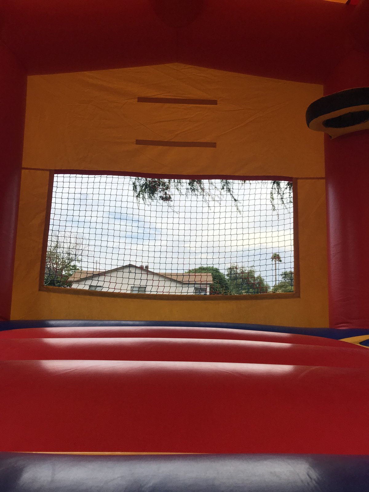 13x13 regular banner bounce house rental in San Diego — inside view of the jumping floor