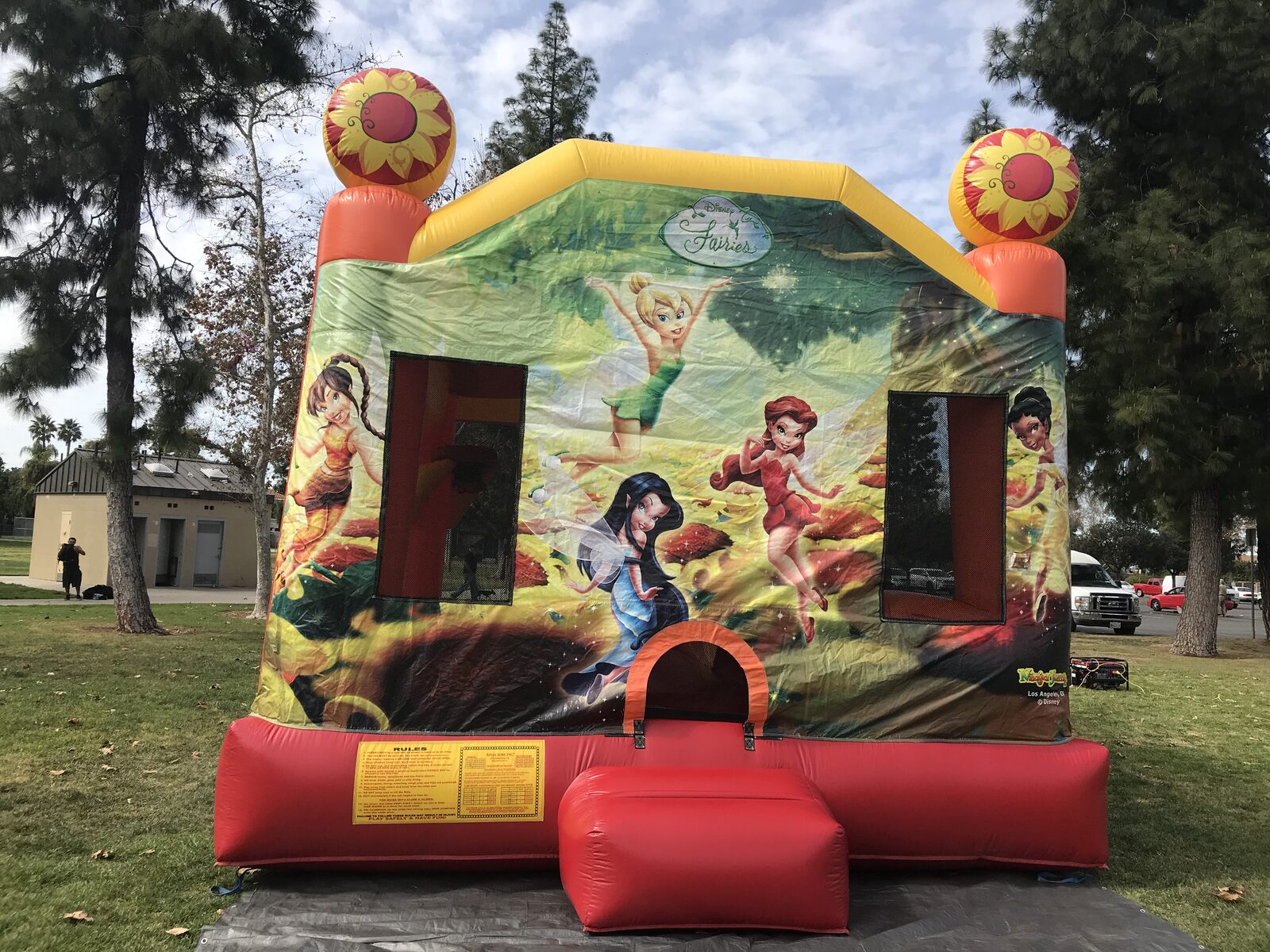 4n1 fairies combo bounce house rental in San Diego, front view of the Disney Fairies art panel with Tinker Bell and sunflower towers