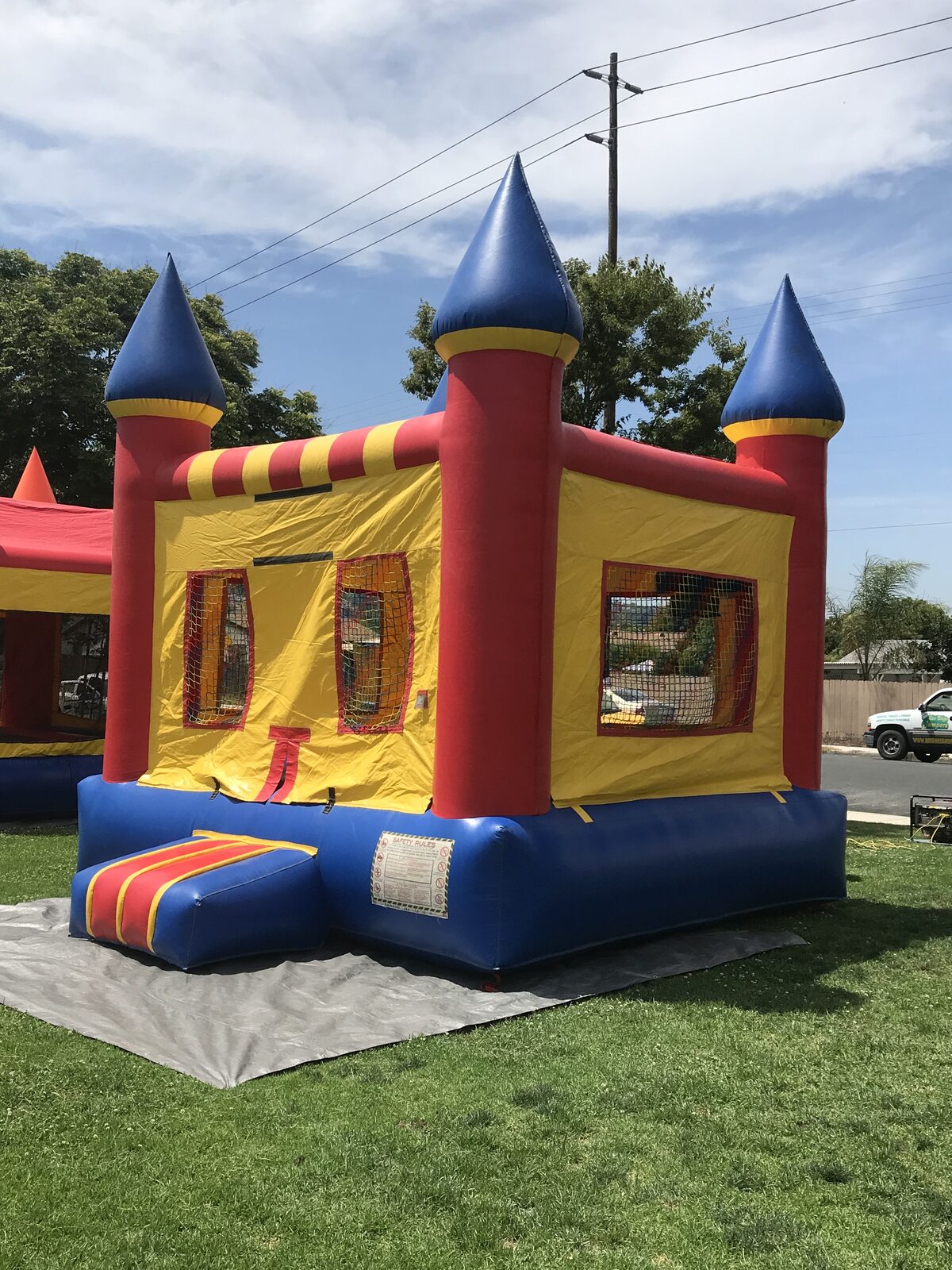 13x13 regular castle bounce house rental in San Diego — view of the jumping floor and basketball hoop inside the unit