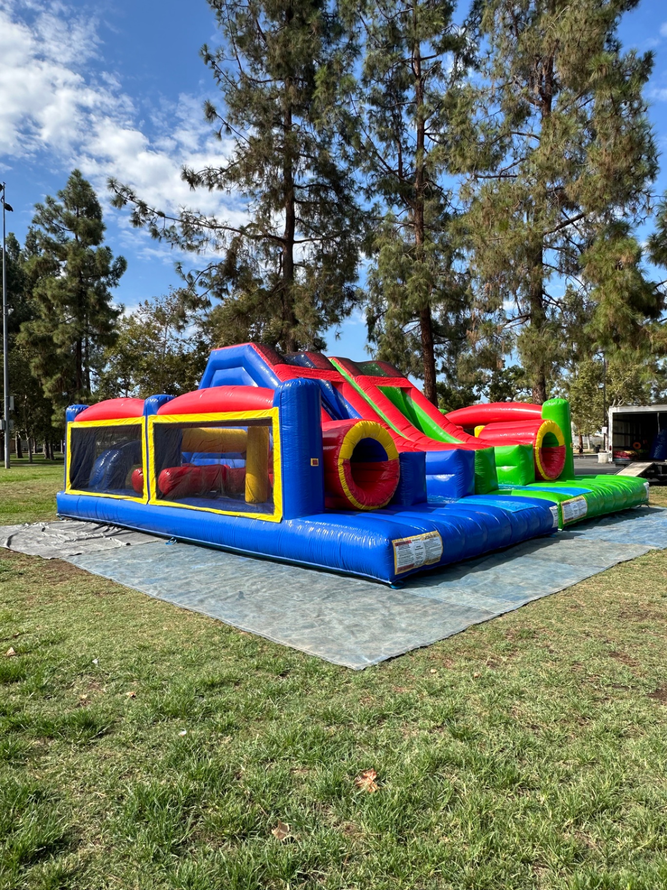 Dual lane challenge course obstacle rental in San Diego, angled view of the mesh obstacle bay ahead of the twin slides