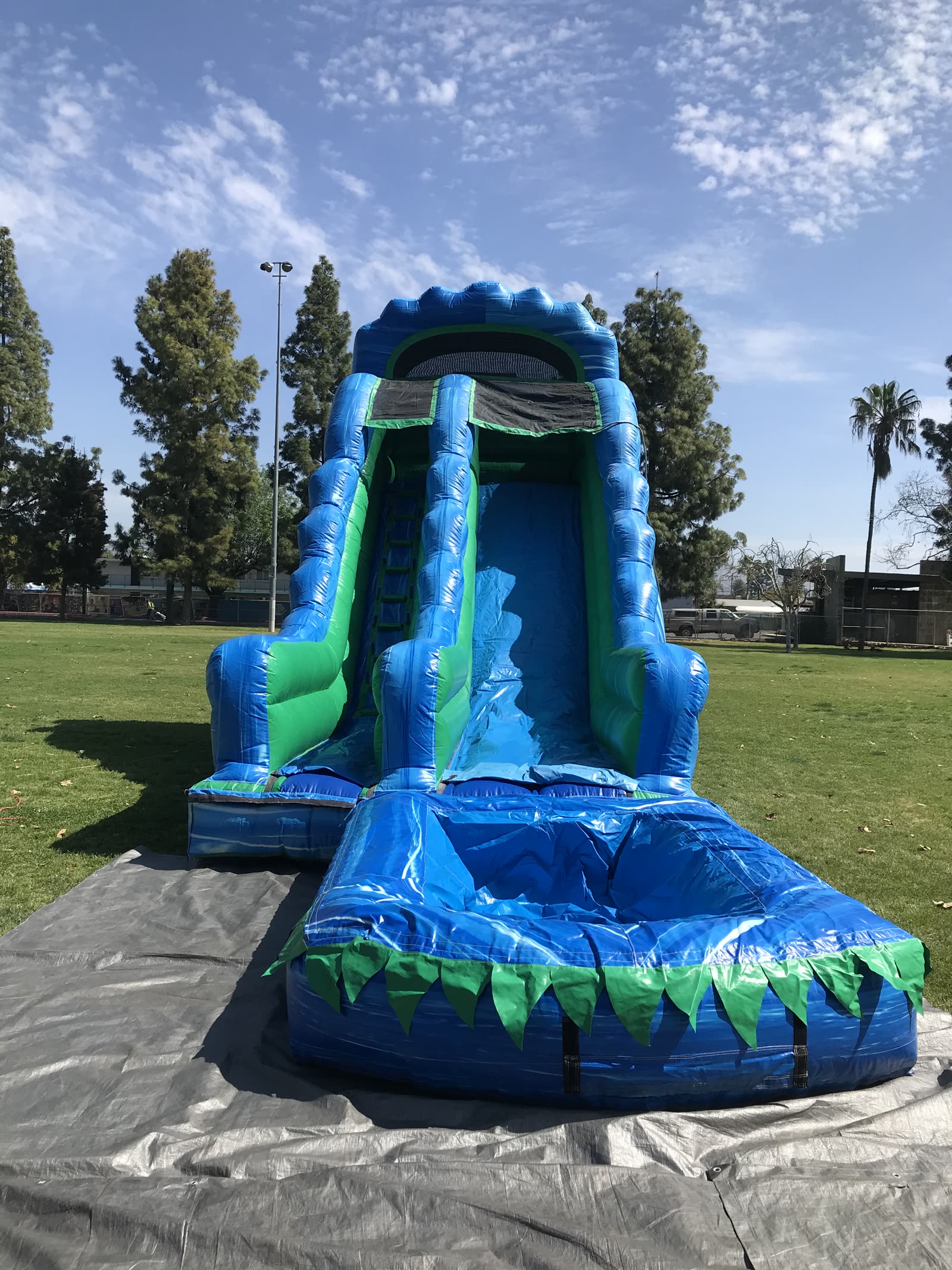 Water slide rental in San Diego, 20ft green and blue marble water slide front view showing the climbing lane, shaded top and splash pool