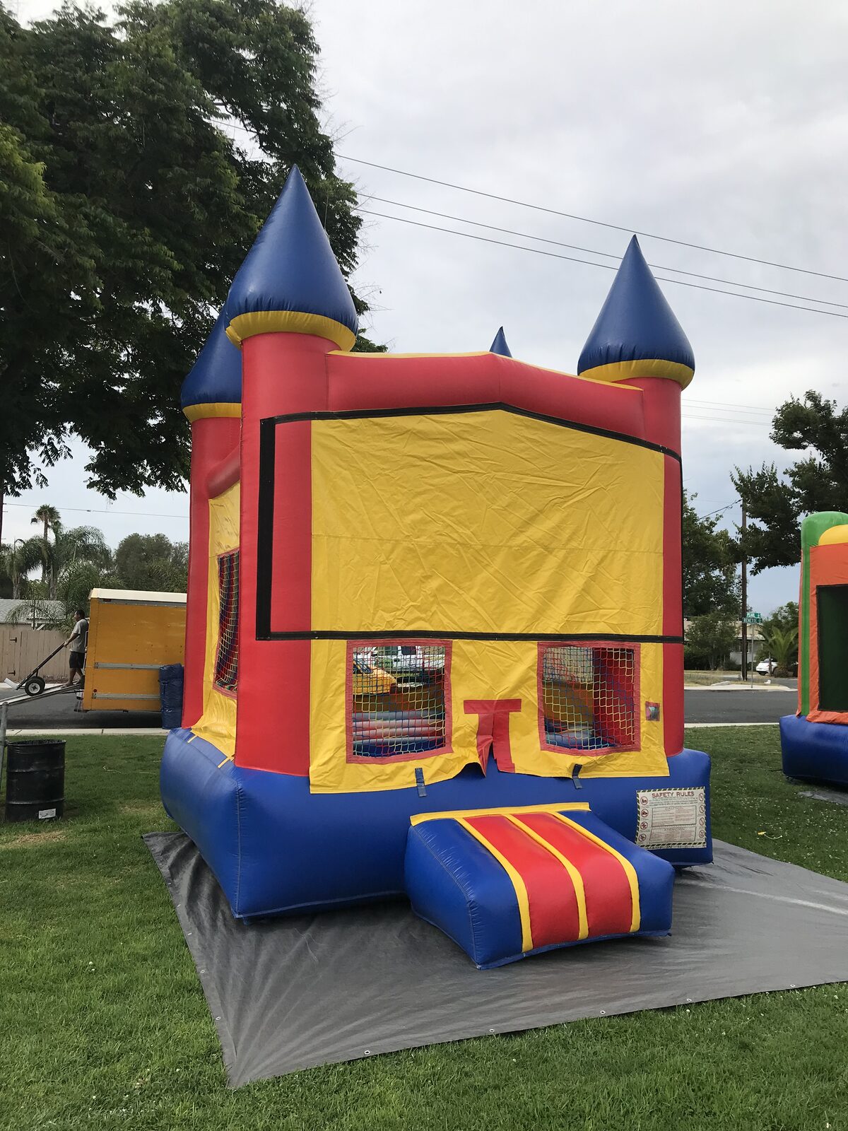 12x14 blue castle banner mini bounce house rental in San Diego, opposite-side angle of the banner panel