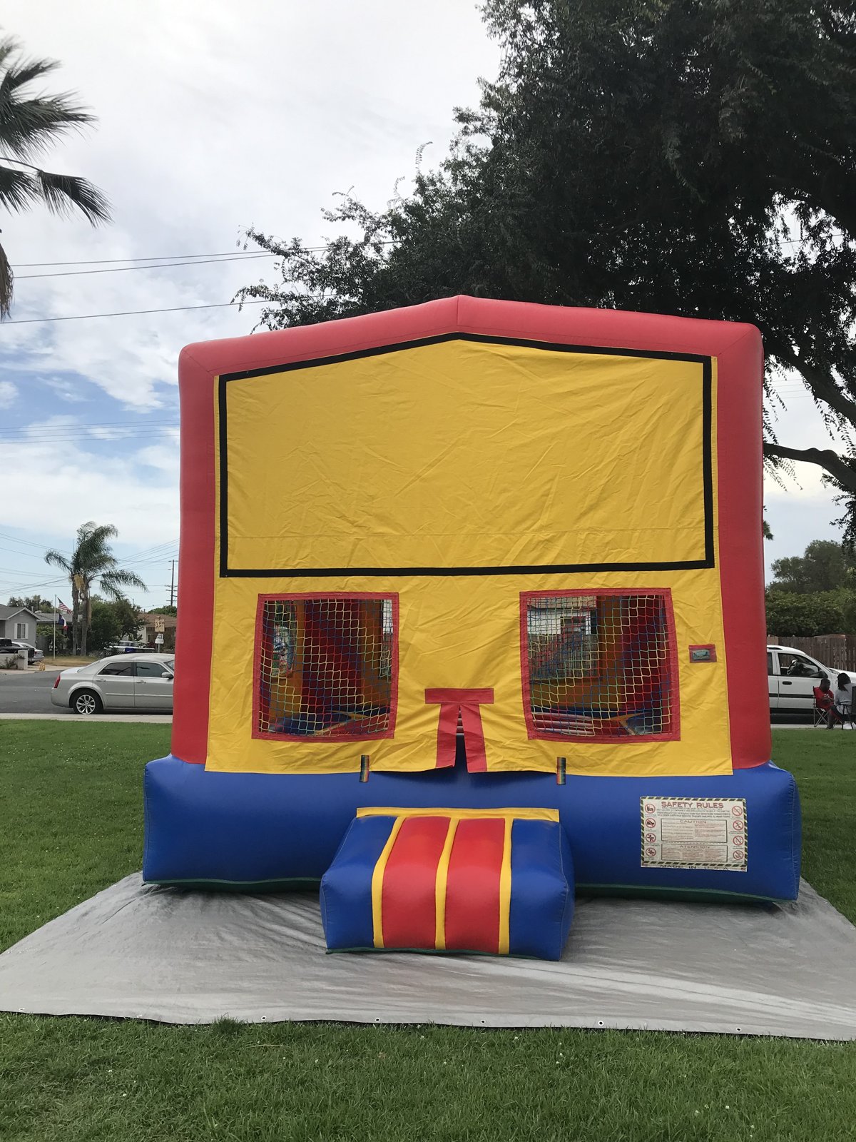 13x13 regular banner bounce house rental in San Diego — front view with blank yellow banner panel ready for a custom theme