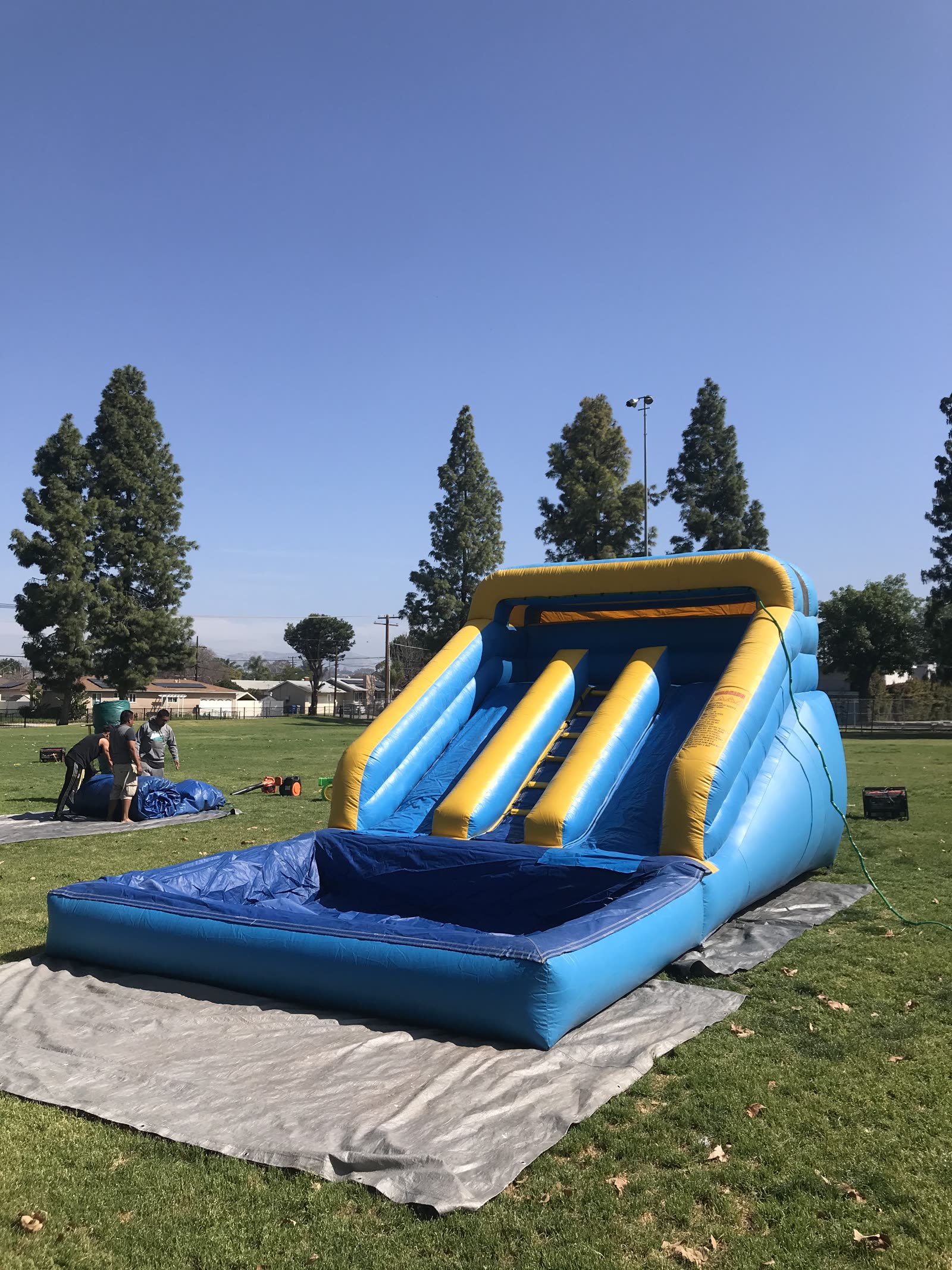 Mini water slide rental in San Diego, 12ft mini dual lane slide wide view showing the full footprint on the tarp