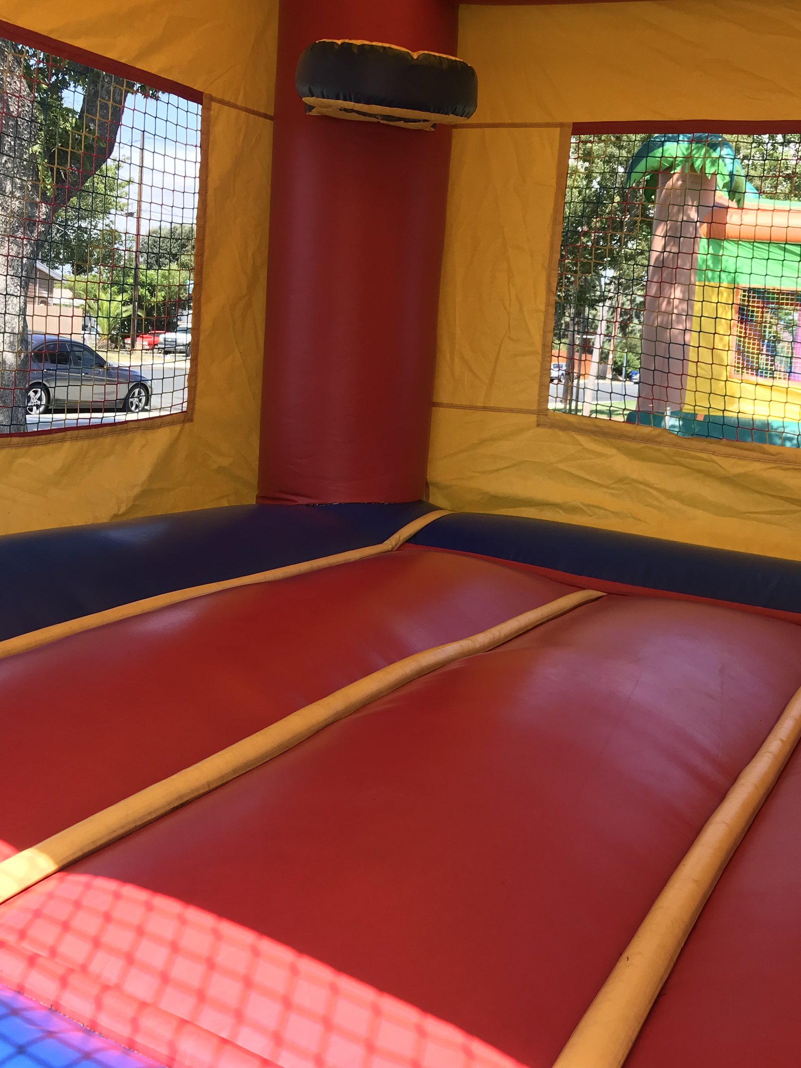 2n1 blue castle combo bounce house rental in San Diego, interior view of the basketball hoop and cushioned corner columns